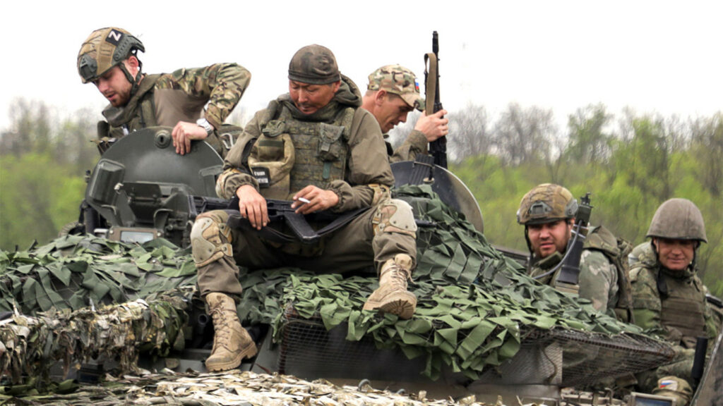 Russian servicemen on a BMP-3 infantry fighting vehicle