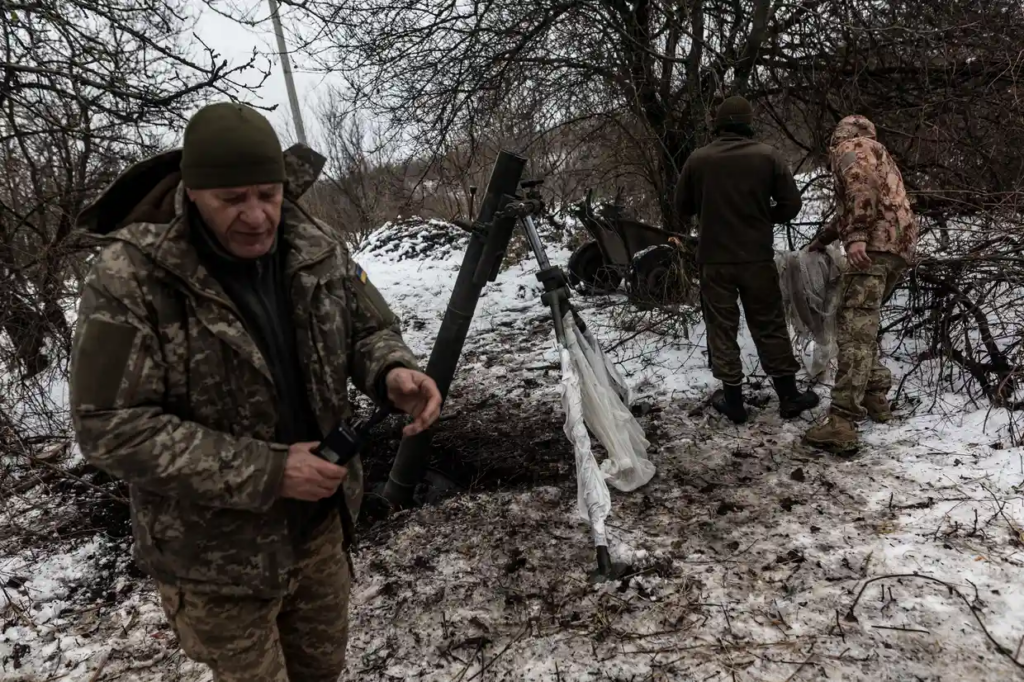Ukrainian soldiers are seen readying a mortar at their defensive position in Kharkiv, facing towards Kupiansk, as the conflict between Russia and Ukraine persists. (Photograph: Anadolu/Getty Images)